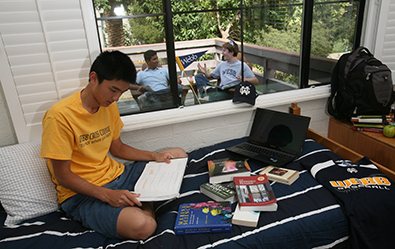 student in his dorm room