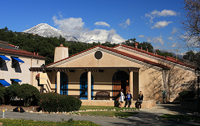 mountains peaking behind campus buildings