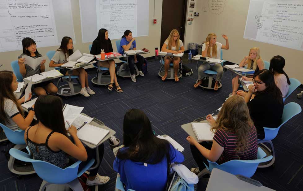 students sitting in a classroom in a circle